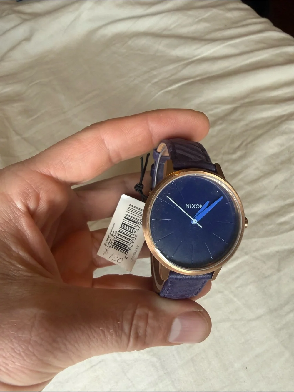 Nixon women’s purple Dial Leather Strap Watch
